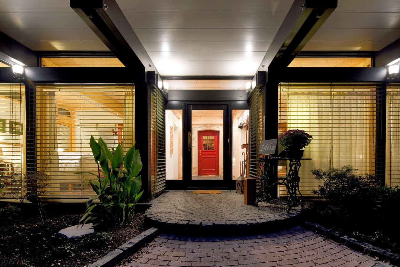 A Florida home at night with its lights on
